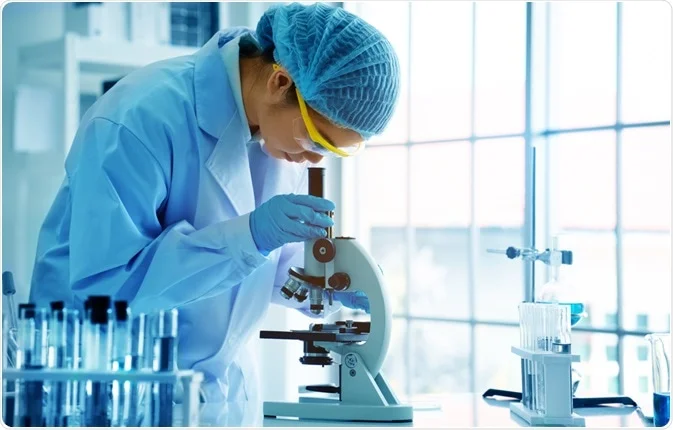 Dr. Lee Young Soo examining samples